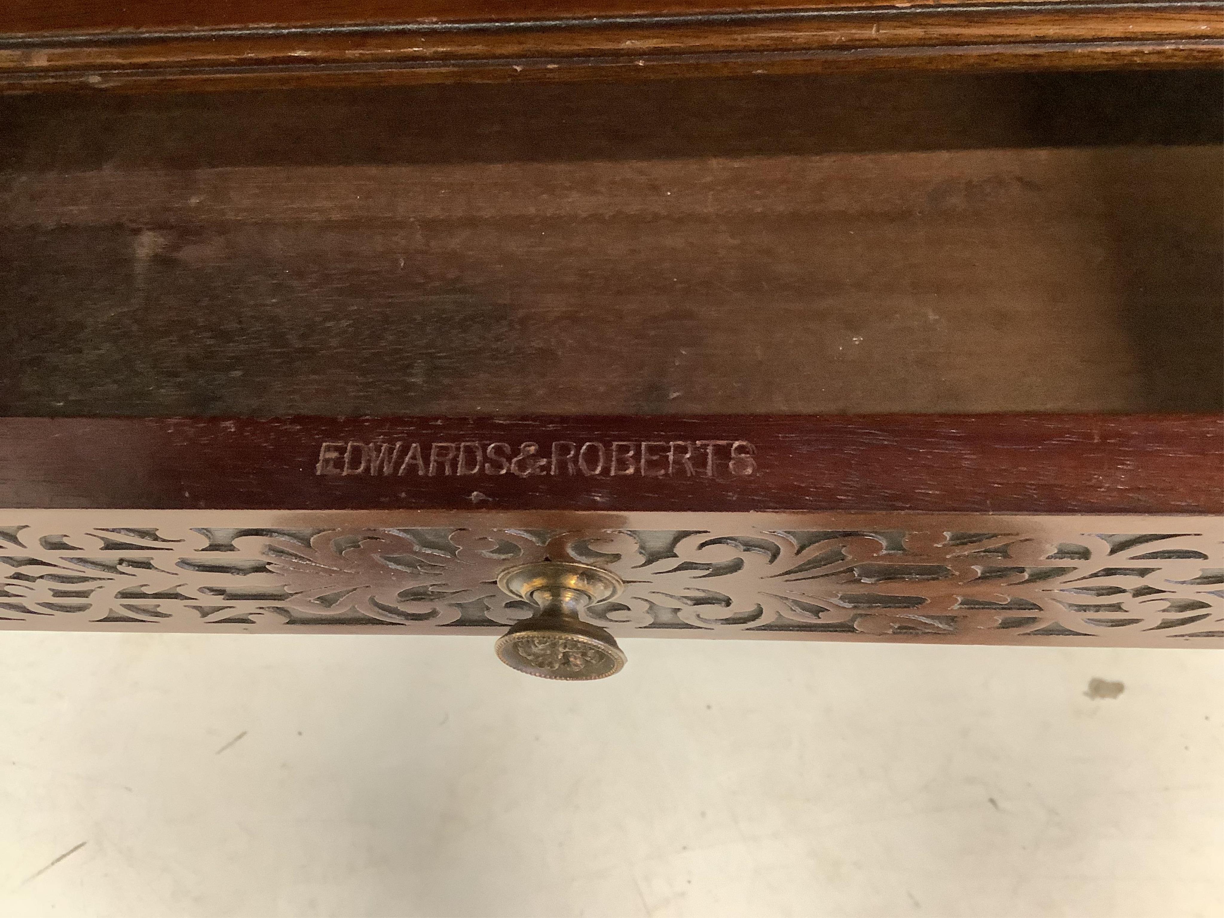 An 18th century walnut toilet mirror, height 43cm, an Edwardian inlaid fret cut wall mirror and an Edwards and Roberts mahogany wall bracket. Condition - fair to good.